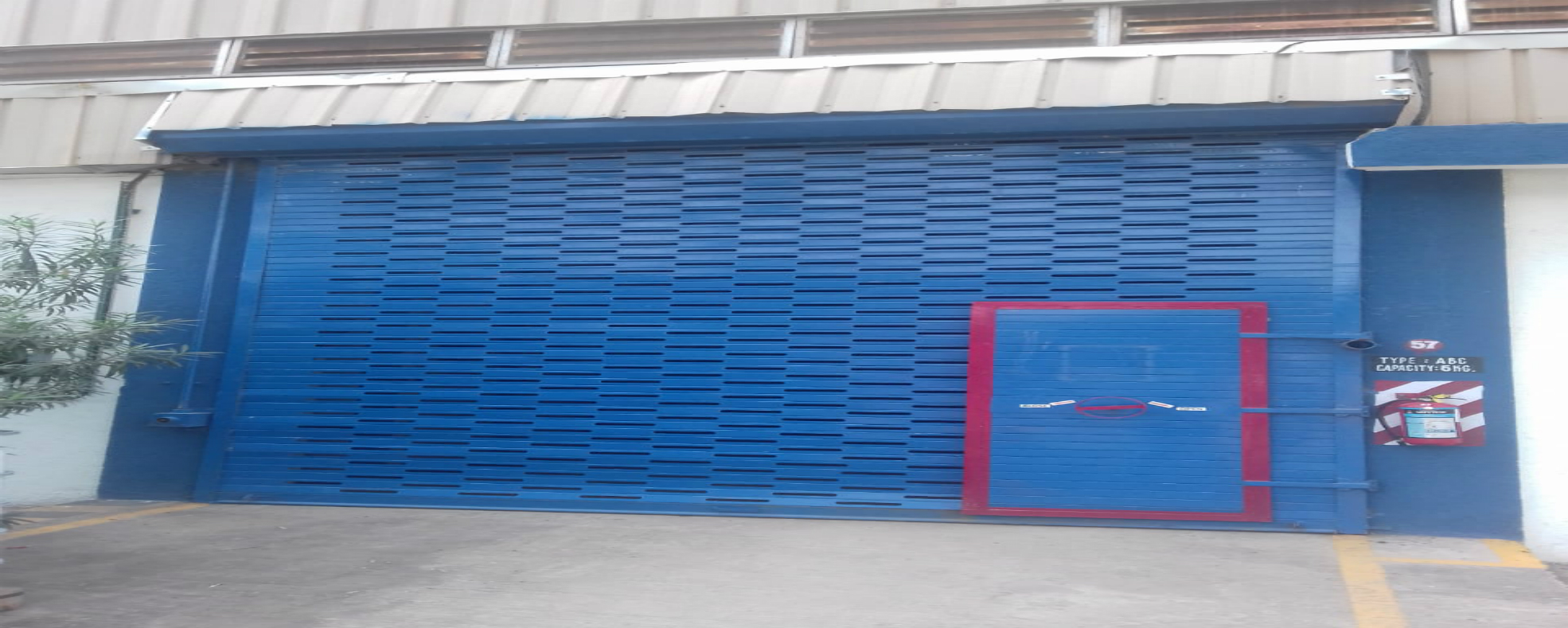 Galvanised perforated rolling shutter
